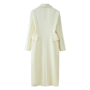 Rear view of long cream wool coat showing slim waist cut and back pleat details
