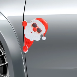 Macro shot of reflective Santa Claus car magnet showing honeycomb texture on door
