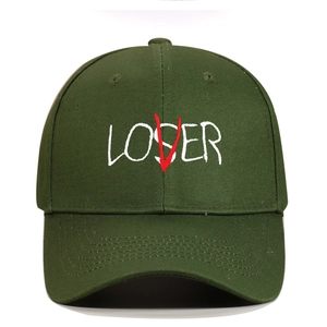 Detailed embroidery view of LOSER letter stitching with red V overlay on dark green twill cap