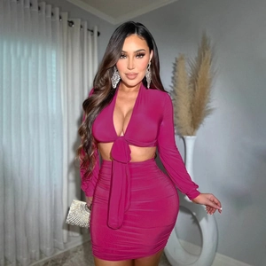 Sexy rose red two-piece set featuring long sleeve lace-up crop top and ruched bodycon skirt
