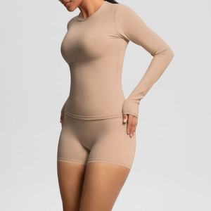 Detailed close-up of high-elasticity yoga set with thumb holes and high waist shorts
