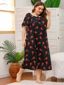 Detail of plus size sleepwear dress with floral bird of paradise print and lace neckline