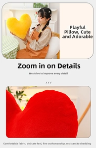 Close-up of the soft plush fabric texture and quality stitching on the heart-shaped pillow
