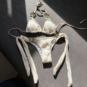 Two-piece ribbed bikini set in cream white with luxury gold chain link details