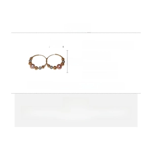 Detail view of pearl hoop earrings with copper beads and dimensions 3.2cm by 3cm