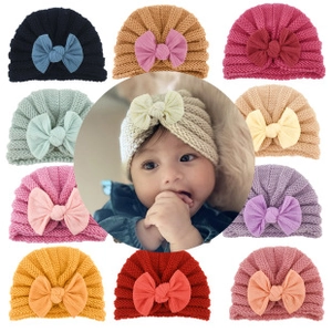 Baby turban hat color selection featuring large bow design and knitted ear protection