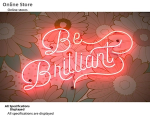 Pink LED neon sign showing Be Brilliant text on floral wallpaper for home wall decor