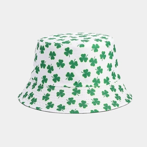 Detailed texture of cotton bucket hat with green shamrock pattern for St. Patrick's Day