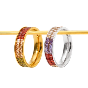 Polished stainless steel rings with colorful zircon crystals in gold and silver finishes