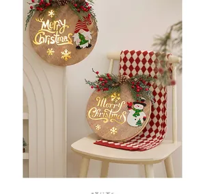 Close-up of LED wooden Christmas plaques with Santa, snowman and Merry Christmas text