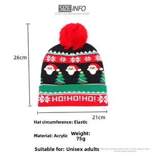 Close-up of festive Christmas knit hat featuring Santa patterns and HO HO HO embroidery