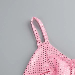 Detail of adjustable straps and shimmering silver sequins on pink elegant dress fabric