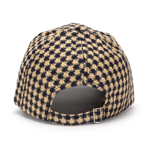 Detail of blue houndstooth baseball cap featuring a premium silver metal adjustable buckle
