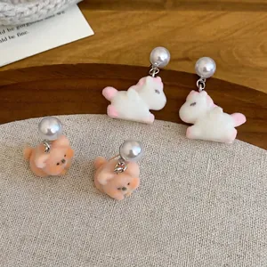 Flocked animal earrings with white unicorn, peach bear, and round pearl studs for women