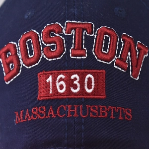 Navy blue cotton baseball cap with detailed red Boston 1630 embroidery and stitching