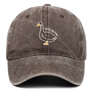 Detail of the silly goose embroidery on a vintage washed cotton baseball cap