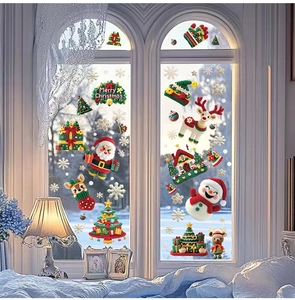 Detail of crochet-style Christmas window decals featuring Santa, reindeer and snowflakes