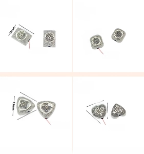 Detailed views of vintage silver DIY spacer beads in square, heart and triangle shapes