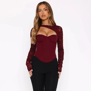 Detail of burgundy lace long sleeve corset top with hollow out design and bone support