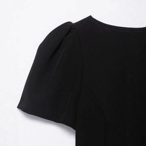 Women's black off-the-shoulder mini dress with puff sleeves and pleated pocket details