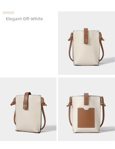 Detail view of a beige pebble leather mini crossbody bag with brown card slot
