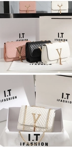 Close-up of quilted stripe crossbody bags with tassel and gold V-buckle detail