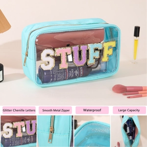 Detail of waterproof PVC toiletry bag featuring glitter chenille letters and metal zipper