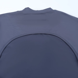Detail of the back neck cutout and stitching on the dusty blue slim fit midi dress
