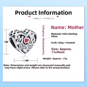 Macro shot of 925 sterling silver heart charm with red enamel MOM engraving and dimensions