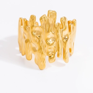 Macro shot of 18k gold plated ring featuring unique molten texture on polished metal