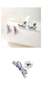 Detail of colorful zircon bow earrings with screw back design and polished silver finish