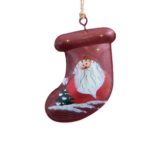 Retro iron Christmas stocking ornament with Santa and tree pattern on white background