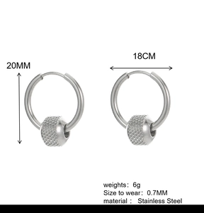 Detail of silver stainless steel hoop earrings showing 20mm height and knurled bead texture