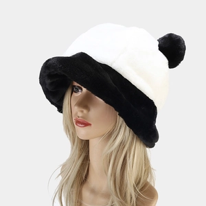 Close-up of winter plush panda bucket hat with black fluffy ears on a female head model