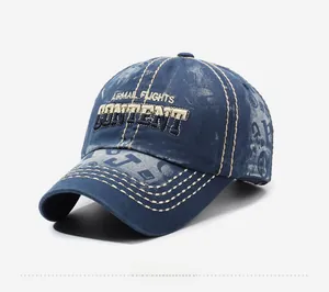 Detailed embroidery of AIRMAIL FLIGHTS on vintage washed blue cotton baseball cap