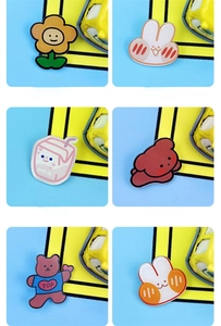 Collage of six cute acrylic cartoon badges with rabbit, puppy and flower motifs
