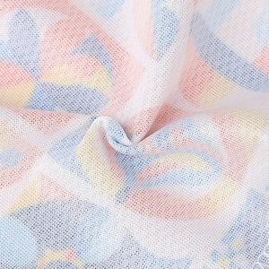 Close-up of lightweight breathable mesh fabric with colorful abstract geometric pattern