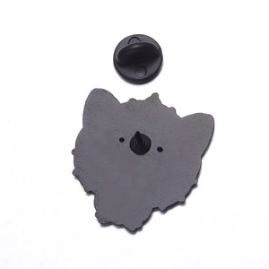 Detail of metal enamel pin back with sandblasted texture and black rubber clutch