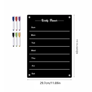 Macro view of black acrylic weekly planner board with dimensions and six colored markers