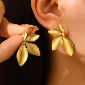 Elegant gold leaf-shaped stainless steel earrings featuring a triple leaf geometric design