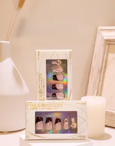 Macro view of French dark coffee press-on nails with luxury 3D champagne rhinestones