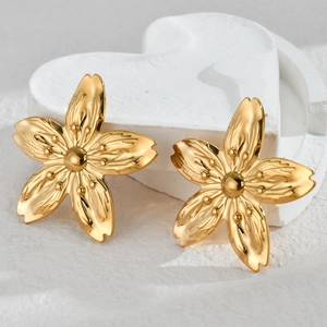 Golden 18K stainless steel floral stud earrings with textured petals on a heart decor
