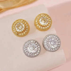 Detailed view of round halo earrings with zircon center stone in gold and silver plating