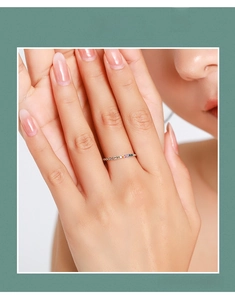 Detail of s925 silver ring band featuring multi-colored micro-inlaid gemstones