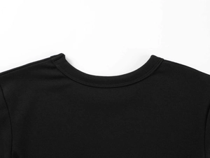 Close-up of a black crew neck modal t-shirt showing ribbed collar and knit texture