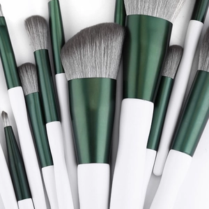Green 12pcs makeup brush set with soft fiber bristles and white matte handles