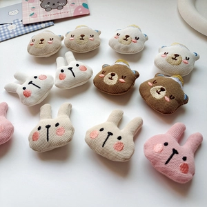 Detail of assorted knitted stuffed bear and rabbit DIY plush heads for crafts