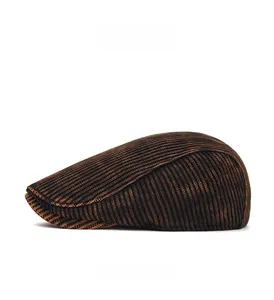 Close-up of side profile showing vertical ribbed texture of a tie-dye knit newsboy cap