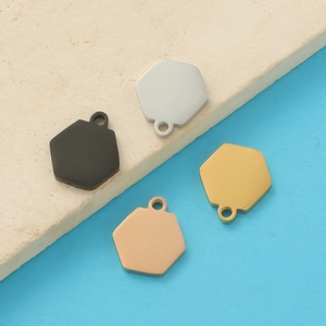 Polished hexagonal stainless steel pendants in black, silver, rose gold and gold finishes