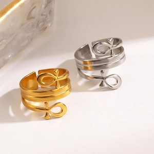 Polished 18K gold and silver stainless steel cross rings in a layered teardrop design